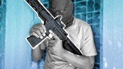 Graphic image showing a gang member in Haiti wit a mask over im head