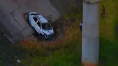 Picture of a TV set taken while TV Globo News shows the car of Greek ambassador in Brazil, Kyriakos Amiridis in Nova Iguacu on December 30, 2016