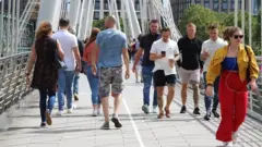 people crossing the bridge