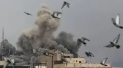 Explosion from one building for Tehran as birds fly away.

