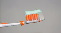 Un cepillo de dientes con crema dental