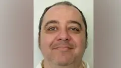 Foto policial de Kenneth Eugene Smith