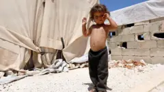 Un niño sirio desplazado.