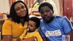 Reme Olotun na Ayokunle Sulaiman wakiwa katika picha ya pamoja na mtoto wa rafiki yao kabla ya lockdown