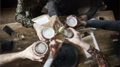 Pint glasses clinking
