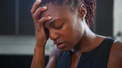 Foto of one woman wey dey frustrated