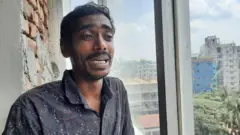 Standing outside the ICU at DNCC Hospital, Mohammad Anwar wept while talking about the child's condition