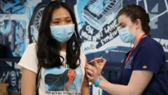 Woman receiving jab
