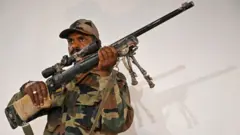 The Army on August 2 said that an M-24 sniper rifle, Improvised explosive devices (IEDs) and landmines belonging to the Pakistani Army along with a telescope were recovered from a terror cache along the Amarnath route. (Photo by TAUSEEF MUSTAFA / AFP) (Photo credit should read TAUSEEF MUSTAFA/AFP/Getty Images)