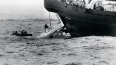 The Pisces craft hauled up after its rescue