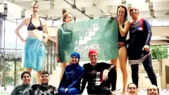 Members of the campaign group Citizen Alliance of Grenoble protest at a community pool in Grenoble, France in 2019