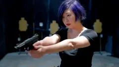 A Taiwan citizen learns how to shoot