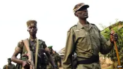 Ifoto yo mu 2012 igaragaza umukuru wa M23 (uri imbere) Sultani Makenga, ubu ufite ipeti rya Jenerali Majoro
