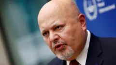 headshot of Karim Khan