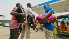Men with motorbike tank
