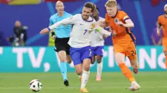 France and Netherland player go for di ball