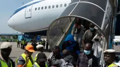 Nigerian passengers, wey dem repatriate from South Africa, come down from one chartered plane afta dem land for Murtala Muhammed international airport Lagos, Nigeria on June 11, 2026.