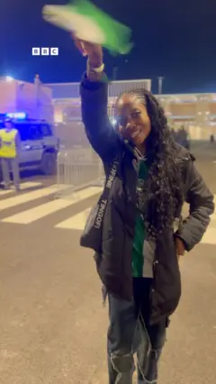 Nigerian fan raising a flag