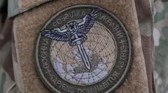 Шеврон розвідки України із совою і мечем