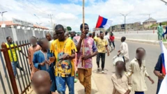 Protesters carrying Russian flag