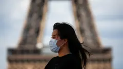 Woman wearing mask in Paris