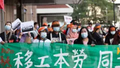 圖為2020年移工團體遊行的資料圖片。