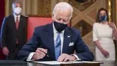 US President Joe Biden signs three documents including an Inauguration declaration, cabinet nominations and sub-cabinet noinations in the Presidents Room at the US Capitol after the inauguration ceremony to making Biden the 46th President of the United States in Washington, DC, USA, 20 January 2021.