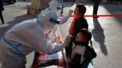 Residents undergoing nucleic acid tests for the Covid-19 coronavirus in Zhangye in China's northwestern Gansu province. - China