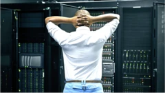 Man upset looking at servers
