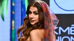 Bollywood actress Rhea Chakraborty presents a creation by designer Guapa during the of the FDCI X Lakme Fashion Week in Mumbai on October 14, 2022. 
