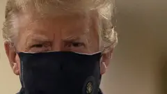 Donald Trump wearing a face mask