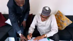 Aworan aarẹ Buhari ati Abba Kyari