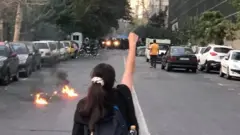 A woman takes part in a protest