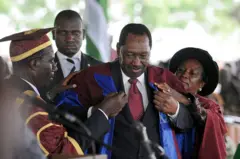 Former Chief Justice of Nigeria dey wear im academic gown for convocation ceremony.