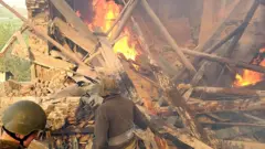 soldiers in front of wreckage