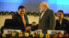 শিল্পপতি গৌতম আদানি ও প্রধানমন্ত্রী মোদী