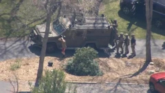 Officers surround a man believed to be Jack Teixeira