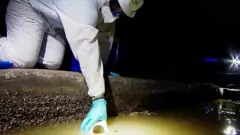 Man testing sewer water