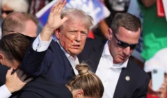 Donald Trump suikast girişiminin hemen sonrasında kürsüden kaçıırlıyor