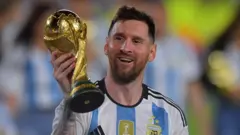 Lionel Messi holding the World Cup trophy