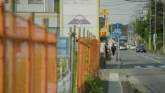 Barriers are seen alongside a road where the mosque is being built