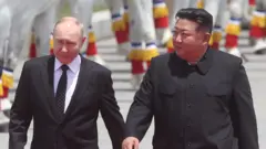Russian President Vladimir Putin (L) and North Korean Supreme Leader Kim Jong Un (R) attend a welcoming ceremony on June 19, 2024 in Pyongyang, North Korea.