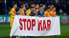 Barcelona and Napoli players showed a "Stop War" banner ahead of their Europa League match on 24 February
