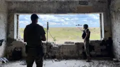 Two resistance fighters send off a drone