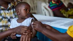 Child being vaccinated