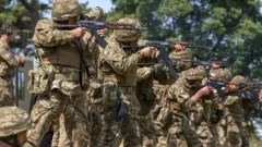 New recruits to the Ukranian army being trained by UK armed forces personnel at a military base near Manchester
