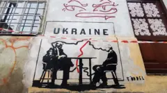 Графітті: Трамп і Путін ділять Україну