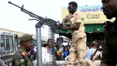Troops from di Sudanese Armed Forces guard an area in the east of the country
