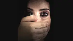 Woman with hand over her mouth