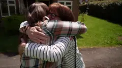 Viv and Theresa hugging